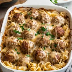 a casserole dish filled with meatballs and noodles