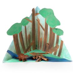 an origami tree with leaves and branches on it