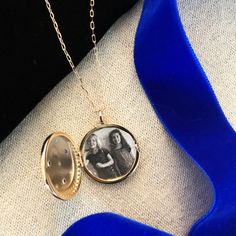 A starry night sky locket with a crescent moon and stars keeps a treasured photo inside. The back is inscribed "you are magic". This is truly a magical gift or keepsake. The locket is 7/8" in diameter and on a 17 1/2" long chain with a 3 1/2" extension. All orders over $50 ship for free within the USA. All orders usually ship within 24 hours. Round Pendant Locket Necklace With Charms For Keepsake, Birthstone Locket Necklace Keepsake, Keepsake Birthstone Locket Pendant Necklace, Keepsake Birthstone Pendant Locket Necklace, Birthstone Medallion Locket Necklace As A Gift, Medallion Locket Necklace With Birthstone For Gift, Keepsake Birthstone Locket Necklace, Round Birthstone Locket Necklace Keepsake, Round Locket Necklace With Charms For Keepsake