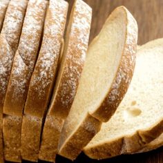 sliced bread sitting on top of a wooden table