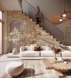 a living room filled with white furniture and lots of windows next to a stair case