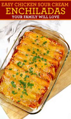 chicken enchiladas in a casserole dish on a wooden cutting board