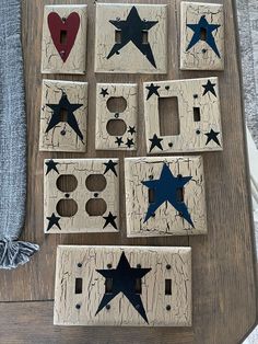 eight wooden stars are placed on the wall to make a star light switch plate cover