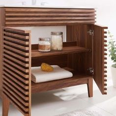 a wooden shelf with towels and other items on it