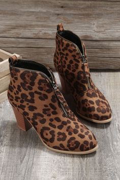 Leopard faux suede booties with a zipper front and chunky heels. Fall Round Toe Booties With Zipper Closure, Fall Booties With Zipper Closure And Round Toe, Trendy Brown Boots With Zipper, Trendy Brown Boots With Zipper Closure, Brown Boots With Zipper Closure And Block Heel, Trendy Fall Boots With Side Zipper, Trendy Ankle-high Booties With Zipper, Trendy Ankle-high Booties With Zipper Closure, Trendy Side Zipper Boots For Fall