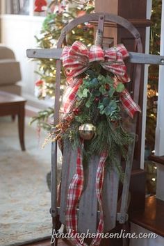 a wooden sled with a christmas wreath on it