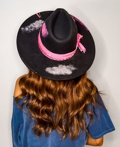 Introducing our Rose Boho Flat Brim Hat, the perfect accessory for any western fashion enthusiast. This black hat features a stunning pink ribbon, fun charms, and intricate stitchings that add a touch of bohemian flair. The brim is adorned with various shades of pink glitter, adding a playful and eye-catching element to the design. Whether you're hitting the rodeo or simply looking to make a statement, this hat is sure to turn heads and elevate your western-inspired look. Embrace your inner cowgirl with this unique and stylish Rose Boho Hat. Trendy Hats For Kentucky Derby Festival, Country Style Flat Brim Hat For Party, Country Style Flat Brim Party Hat, Custom Felt Hat For Rodeo, Flat Brim Hat, Boho Hat, Western Hats, Cowgirl Hats, Brim Hat