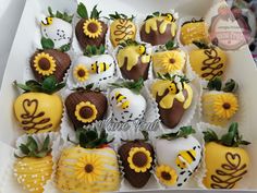 chocolate covered strawberries with sunflower decorations in a box