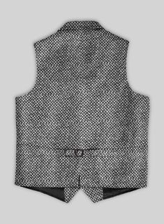 Reshuffle the winter wardrobe for an occasional styling with the addition of our Highlander Heavy Honeycomb Gray Tweed Hunting Vest. However, it is constructed from a sturdy blend of wool and polyester fabrics which exhibits a deep, rugged and significant warmth to appear in chilly weather. Also, a honeycomb pattern covers the gray shade, giving the cloth a versatile edge.    The Hunting Vest was inspired and worn by the British and American in the late 19th century and early 20th century. In o Fitted Black Tweed Jacket For Winter, Fitted Gray Tweed Jacket, Fitted Black Tweed Jacket With Houndstooth Pattern, Black Wool Outerwear With Herringbone Pattern, Black Wool Herringbone Outerwear, Gray Wool Tweed Jacket For Winter, Wool Tweed Jacket With Herringbone Pattern For Winter, Winter Wool Tweed Jacket With Herringbone Pattern, Winter Gray Wool Tweed Jacket