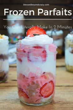 a jar filled with desserts sitting on top of a wooden table next to other jars