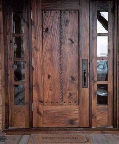 an old wooden door with glass panels