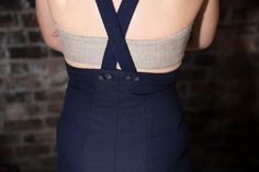 "Originally by Vogue (9016), (\"Easy to Make\") 'Slacks with built-up or regulation waist line and choice of long or below-knee length. Built-up version is dart-fitted at front and back with patch pockets at front. Slacks finished on belt at waist line have dart fullness released at front and patch pockets at back. Ribbon suspenders buttoned over elastic loops at front are optional. Turned back cuffs on long version. Blouse is not included.' This is a digitally-drafted 7-piece multi-size pattern Fitted Summer Pants With Buttons, Fitted Knee-length Bottoms With Buttons, Fitted High Waist Bottoms With Back Zipper, Fitted Bottoms With Back Zipper For Spring, Fitted Knee-length Pants For Work, Fitted Pants With Waistband For Summer, Fitted Summer Pants With Waistband, High Waist Fitted Pants With Waistband, Fitted High Waist Pants