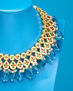 Drawing on jewelry from Mughal courts, the Sharawar Necklace in Sapphire Blue is an opulent showstopper. It adds a striking accent to many a NicoBlu style. May be worn as a reversible style, as the necklace is finished on both sides (one that is clear glass, the other repoussé enamel). • Gold plated • Sapphire blue glass • Reversible: clear glass on one side, repoussé enamel on the other • Slide tie closure, as shown • Hand-crafted • 6.5oz • Zinc free • Includes a NicoBlu gift bag (prints and co Temple Jewelry Necklaces With Jewels For Festivals, Festival Temple Jewelry Necklaces With Jewels, Blue Tilla Fusion Jewelry, Blue Fusion Style Tilla Jewelry, Blue Fusion Tilla Jewelry, Fusion Style Blue Kundan Jewelry, Blue Chandbali Jewelry With Cutdana Detail, Blue Chandbali Jewelry With Cutdana, Blue Cutdana Chandbali Jewelry