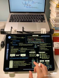 a laptop computer sitting on top of a desk