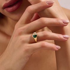 Immerse yourself in the allure of nature with our Green Enamel Blossom Signet Ring. This enchanting piece features a green enamel base, intricately paved with flower-shaped sparkling stones, creating a harmonious blend of elegance and botanical charm. Whether worn as a standalone statement piece or paired with other favorites, the Green Enamel Blossom Signet Ring is a celebration of natural beauty and a unique addition to your jewelry collection. - Made in 14k solid gold - Decorated with handset Luxury Elegant Green Signet Ring, Luxury Green Elegant Signet Ring, Elegant Formal Enamel Signet Ring, Elegant Enamel Signet Ring, Luxury Green 14k Gold Signet Ring, Green Enamel, Gold Decor, Flower Shape, Signet Ring