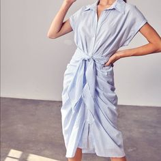 Features: -Button Down Tie Front Woven Dress -100% Cotton -Lined -Color: White/Light Blue Stripes For Reference Model Weighs 120lbs And Is Wearing A Small Waist On A Small Laying Flat Measures 13” Follow Me On Instagram @Chic_in_miami_boutique Light Blue Shirt Dress For Spring Beach Outing, Light Blue Shirt Dress For Spring Beach, Light Blue Shirt Dress For Beach In Spring, Collared Light Blue Shirt Dress For Summer, Light Blue Collared Shirt Dress For Summer, Chic Midi Shirt Dress For Daytime, Chic Midi Length Shirt Dress For Daytime, Summer Shirt Dress With Buttons For Daytime, Summer Daytime Shirt Dress With Buttons