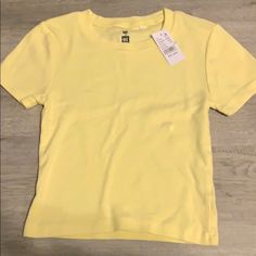 Light Yellow Crop Tee -Very Soft And Comfortable -Brand New -Very Popular Top -Open To All Questions And Offers Basic Yellow Tops For Spring, Basic Yellow Shirt For Summer, Basic Tan Tops For Spring, Light Yellow Shirt, Cute Yellow Relaxed Fit T-shirt, Cheap Fitted Yellow T-shirt, Cheap Yellow Plain T-shirt, Cheap Yellow Everyday T-shirt, Mauve Top