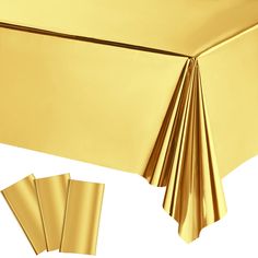 gold tablecloths and napkins on a white background with clipping for text