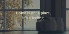 an open window with the words home is not a place, it's a feeling