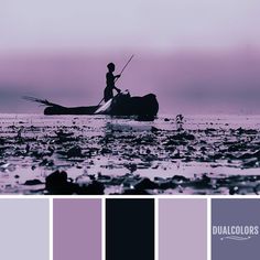 a person on a boat in the water with purple and black color palettes around it