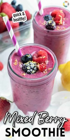 mixed berry smoothie in a glass with strawberries and blueberries