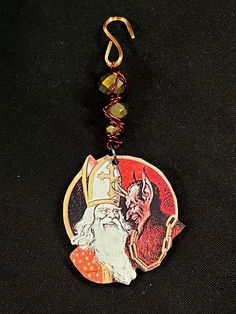 a keychain with an image of santa claus on it