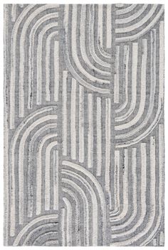 a gray and white area rug with wavy lines on it, in front of a white background