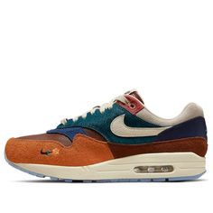 Step into love with the Nike Kasina x Air Max 1 SP 'WonAng Orange'. This collaboration between Nike and Kasina celebrates the traditional culture and showcases the beauty of the Air Max 1. Inspired by the symbol of love and connection, the Mandarin Ducks, the sneaker features a Mandarin Duck embroidery on the heel and two Mandarin Ducks on the semi-translucent outsole. The multi-color upper and the exclusive wooden lace lock make it perfect for any occasion. The special edition also comes with a Nike Air Orange, Nike Orange Sneakers With Contrast Sole, Orange Synthetic Dynamic Sneakers, Duck Embroidery, Duck Keychain, Orange Air Max Sneakers For Streetwear, Mandarin Ducks, Nike Air Max Primary Colors, Mandarin Duck