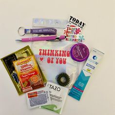 the contents of a travel bag laid out on top of each other, including toothbrushes