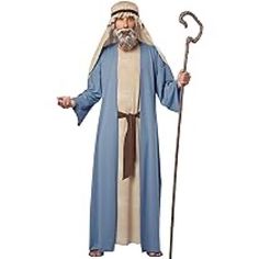 a man dressed in a biblical costume holding an staff and wearing a long blue robe