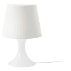 a white lamp with a cord attached to it