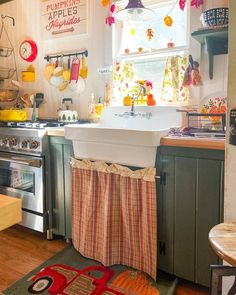 a kitchen filled with lots of appliances and decor