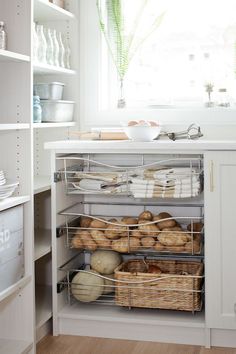 an open cabinet in a kitchen filled with food