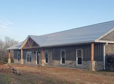 a large building sitting on top of a dirt field