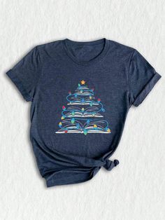 Get ready to celebrate the joy of the holiday season with our enchanting **holiday shirt**! This **cute Christmas tee** is designed for those who embrace the spirit of giving and cozy moments. Featuring a whimsical print that celebrates the magic of festive traditions, this **Christmas shirt** is perfect for your next **Christmas reunion** or as a standout piece in your **Christmas outfit** lineup. Are you a book lover? Our **books Christmas** design adds a unique twist that will resonate with any avid reader. This **book lovers shirt** is an ideal choice for the **bookworm Christmas** in your life, showcasing a playful homage to books and trees that leaves everyone smiling. Whether you're attending a cozy gathering, snuggling with a cup of cocoa, or gifting a special **gift for teachers** Pta Shirts, Quilt Shirt, Light Tree, Bookworm Shirt, Librarian Shirt, Christmas Gifts For Husband, Christmas Tree Shirt, Cartoon Christmas, Santa Shirts