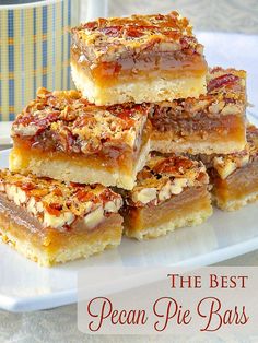 the best pecan pie bars are stacked on top of each other