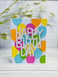 a happy birthday card with balloons on it