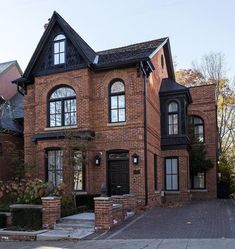 a large brick house with many windows