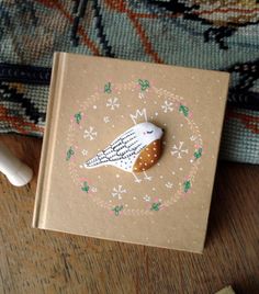 a small book with a bird on it