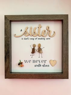 "This picture can be made with more people (enter the number in the personalization box) and you can have the names added at the bottom in small handwriting.  The word 'sister' and the heart are unfinished wood cutouts.  The frame is for an 8x8\" picture with a protective glass in front and hanging fixtures on the back. Please notice that every pebble is unique. The picture is just for reference, as every item is made to order. Shapes, colors and sizes can vary. I always send a preview before I ship it out.  There's gift wrap available at checkout. If you choose to add a gift message, it will be handwritten in a small courtesy card."