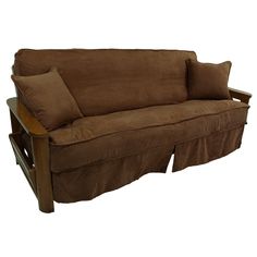 a brown couch with two pillows on it