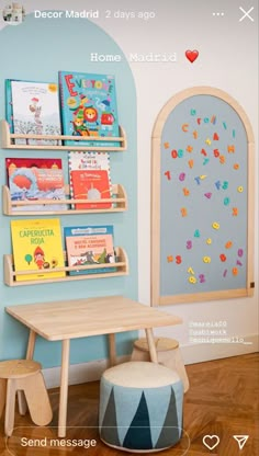 the children's room is decorated in blue and white with bookshelves on each shelf