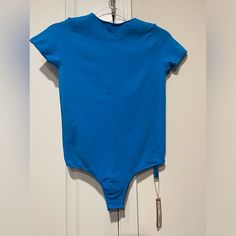 Essential T Shirt Bodysuit In The Color Mykonos (Color Is A Lighter Blue In Person) Size Large/X Large New With Tags Bundle 3 Items Or More And Save 15% Fitted Blue Crew Neck Swimwear, Fitted Blue Swimwear With Crew Neck, Fitted Sports Bodysuit With Short Sleeves, Fitted Short Sleeve Bodysuit For Sports, Fitted Short Sleeve Sports Bodysuit, Blue Fitted Cotton Short Sleeve Bodysuit, Casual Blue Crew Neck Swimwear, Blue Casual Short Sleeve Bodysuit For Summer, Casual Short Sleeve Bodysuit For Sports