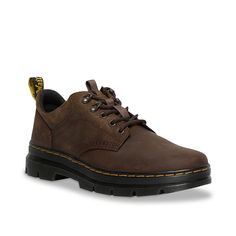 Dr. Martens-Reeder Utility Oxford - Men's Your everyday wear won't be the same when you lace-up the stylish Reeder utility oxford by Dr. Martens. Besides the heavy-duty leather construction, this lace-up comprises grooved edges, an AirWair heel loop and visible stitching that stays true to the Core Dr. Martens Dna. Lug sole is cemented to the upper for lasting and flexible strolls. Visible Stitching, Mens Oxfords, Lug Sole, Hiking Boots, Dark Brown, Heavy Duty, Oxford, Everyday Wear, Stitching