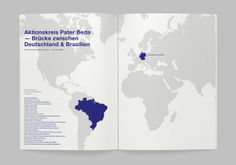 an open book showing the map of the world with blue and white colors on it