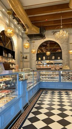 the inside of a bakery with many baked goods