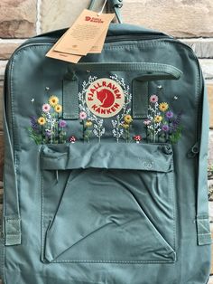 Welcome to my store and choose the perfect hand-embroidered fjallraven kanken backpack   Version & Size + Medium size: 38x27x13cm  + Big size: 42x32x13cm  - Product price includes: hand-embroidered fjallraven kanken backpack and design as shown in the picture - I can make fjallraven kanken backpack hand embroidery patterns according to your ideas - fjallraven kanken backpack will be hand embroidered with thread that won't fade when washed - fjallraven kanken backpack has a small front compartmen Fjallraven Kanken Embroidered, Kanken Backpack Embroidery, Embroidered Kanken, Kanken Embroidery, Backpack Embroidery, Mochila Fjallraven Kanken, Kanken Classic, Backpack Fjallraven, Embroidered Backpack