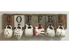 coffee mugs are hanging on the wall