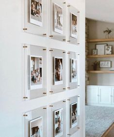 a wall with many pictures hanging on it's sides and some shelves in the background