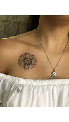 a woman with a sunflower tattoo on her chest